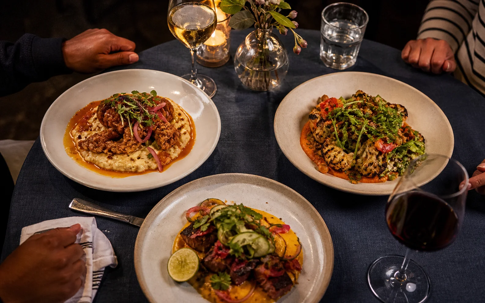Seasonal dishes shared at an independent restaurant table